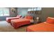 Spacious bedroom featuring three beds, offering comfortable accommodations for multiple guests at 1016 Rhodes Ave, Sarasota, FL 34237