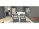 Versatile bonus room with comfortable seating, and laundry area, ideal for relaxation or entertainment at 1016 Rhodes Ave, Sarasota, FL 34237