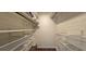 Organized walk-in closet with built-in shelving and ample storage space, perfect for keeping belongings tidy at 1016 Rhodes Ave, Sarasota, FL 34237