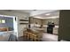 Bright and airy kitchen with granite countertops, modern appliances, and breakfast bar seating at 1016 Rhodes Ave, Sarasota, FL 34237