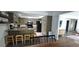 Well-equipped kitchen with granite countertops, updated appliances, and breakfast bar seating at 1016 Rhodes Ave, Sarasota, FL 34237