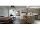 Stylish kitchen with granite countertops, stainless steel appliances, and wood-look flooring at 1016 Rhodes Ave, Sarasota, FL 34237