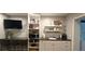 Compact kitchenette with modern appliances, sleek countertops, and smart storage solutions for urban living at 1016 Rhodes Ave, Sarasota, FL 34237