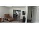 Inviting living space with a smooth transition to the dining area, and a modern entertainment center at 1016 Rhodes Ave, Sarasota, FL 34237