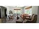 Bright living room with lots of natural light, neutral paint, and lovely contemporary furniture at 1016 Rhodes Ave, Sarasota, FL 34237