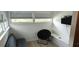 Cozy living room with a chair and loveseat offering a relaxing seating arrangement at 1016 Rhodes Ave, Sarasota, FL 34237