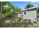 Well-kept yard with tropical palm trees, lawn and a practical mini-split system at 1019 S Tuttle Ave, Sarasota, FL 34237