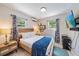 Bedroom with bright natural light and coastal-themed decor at 1019 S Tuttle Ave, Sarasota, FL 34237