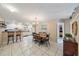 Open-concept dining area with tile flooring, adjacent to the kitchen and breakfast bar at 1019 S Tuttle Ave, Sarasota, FL 34237