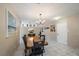 Elegant dining room with stylish chandelier, seating for six, and modern decor at 1019 S Tuttle Ave, Sarasota, FL 34237