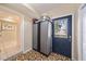 Entryway featuring tiled floors, closet storage, and view of another room at 1019 S Tuttle Ave, Sarasota, FL 34237