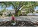 Charming single-story home with lush landscaping and a welcoming front entrance at 1019 S Tuttle Ave, Sarasota, FL 34237
