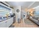 Compact kitchen adjacent to living room with stainless steel appliances at 1019 S Tuttle Ave, Sarasota, FL 34237