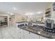Open-concept kitchen with stone counters, seamlessly flowing into the living area at 1019 S Tuttle Ave, Sarasota, FL 34237