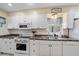 This kitchen features modern appliances and ample counter space for meal preparation at 1019 S Tuttle Ave, Sarasota, FL 34237