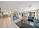 Spacious living room with open floor plan, tile flooring, and access to the outdoor pool at 1019 S Tuttle Ave, Sarasota, FL 34237