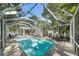 Beautiful screened-in pool with spa and a spacious patio perfect for entertaining at 1019 S Tuttle Ave, Sarasota, FL 34237
