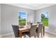Elegant dining room with stylish furnishings, modern decor and serene views of the outdoors at 10539 Kidron Ave, Englewood, FL 34224