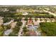 A lovely aerial view of a home in a tranquil neighborhood featuring a sparkling pool and lush landscaping at 11021 4Th E Ave, Bradenton, FL 34212