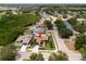 Aerial shot showcases the property's location within a residential community, near green spaces and a golf course at 11021 4Th E Ave, Bradenton, FL 34212