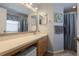 Bathroom with vanity, mirror, and shower/tub combo with gray curtain at 11021 4Th E Ave, Bradenton, FL 34212
