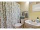 Bathroom with a vanity, floral shower curtain, and ample counter space at 11021 4Th E Ave, Bradenton, FL 34212