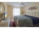 Cozy bedroom with a large window, ceiling fan and adjacent closet at 11021 4Th E Ave, Bradenton, FL 34212