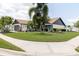 Well maintained house with a green lawn and beautiful landscaping at 11021 4Th E Ave, Bradenton, FL 34212