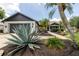 Well-maintained front yard featuring lush plants and a spacious two-car garage at 11021 4Th E Ave, Bradenton, FL 34212