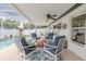An outdoor patio seating area with a table set for outdoor meals with access to the pool at 11021 4Th E Ave, Bradenton, FL 34212