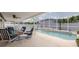 Relaxing screened pool patio with comfortable seating, perfect for enjoying outdoor living at 11021 4Th E Ave, Bradenton, FL 34212