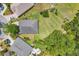 An aerial view shows the house, backyard, patio, and some of the surrounding neighborhood at 11208 Blue Sage Pl, Lakewood Ranch, FL 34202