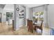 Bright breakfast nook with a modern table and chairs, filled with natural light from a large window at 11208 Blue Sage Pl, Lakewood Ranch, FL 34202