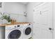 Laundry room with a side-by-side washer and dryer at 11208 Blue Sage Pl, Lakewood Ranch, FL 34202