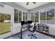 Sunroom office featuring many windows that provide natural light at 11208 Blue Sage Pl, Lakewood Ranch, FL 34202