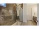 Beautiful bathroom featuring a spacious walk-in shower with decorative tiling and glass door at 11427 Viani Ter, Palmetto, FL 34221