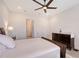 Calm bedroom featuring a large bed, dresser, and neutral color scheme at 11427 Viani Ter, Palmetto, FL 34221