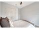 Bedroom with an upholstered bed and large closet doors at 11427 Viani Ter, Palmetto, FL 34221