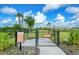 Fenced dog park with separate areas for large and small dogs, offering a safe and social environment for pets at 11427 Viani Ter, Palmetto, FL 34221