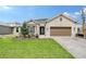 Beautiful single-Gathering home featuring a well-manicured lawn, neutral colored paint, and a two car garage at 11427 Viani Ter, Palmetto, FL 34221