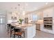 A spacious kitchen with stainless steel appliances, quartz countertop island and pendant lighting at 11427 Viani Ter, Palmetto, FL 34221