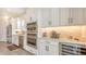 Modern kitchen with stainless steel appliances, wine cooler, and lots of counter space at 11427 Viani Ter, Palmetto, FL 34221