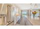Bright kitchen with stainless steel appliances, large island, and a view of the backyard at 11427 Viani Ter, Palmetto, FL 34221