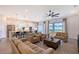 Open floor plan showcasing the living room and modern kitchen with a view to the backyard at 11427 Viani Ter, Palmetto, FL 34221