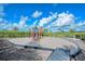 Bright and colorful playground with climbing structures and a cushioned surface, designed for safe and fun outdoor play at 11427 Viani Ter, Palmetto, FL 34221