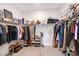 Spacious walk-in closet with ample shelving and hanging space for optimal organization at 11427 Viani Ter, Palmetto, FL 34221