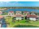This breathtaking aerial shot displays homes beautifully lining a large, picturesque lake at 121 Porta Vecchio Bnd # 201, Nokomis, FL 34275