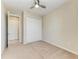Spacious bedroom with carpet, closet and storage, and a ceiling fan at 121 Porta Vecchio Bnd # 201, Nokomis, FL 34275