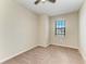 Neutral bedroom with carpeting, a ceiling fan, and a window with blinds at 121 Porta Vecchio Bnd # 201, Nokomis, FL 34275