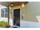 A welcoming front door with a modern design, secure access, and nearby window at 121 Porta Vecchio Bnd # 201, Nokomis, FL 34275